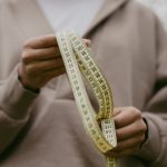Measuring tape and sizing guide for finding the perfect fit in emo cargo pants