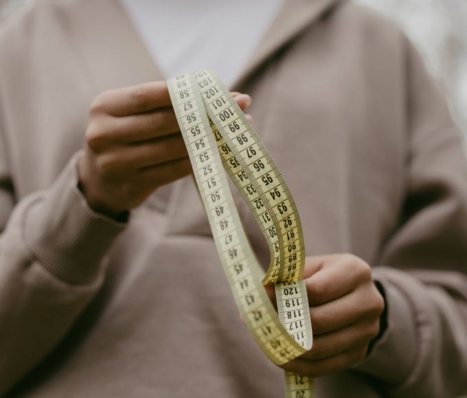 Measuring tape and sizing guide for finding the perfect fit in emo cargo pants