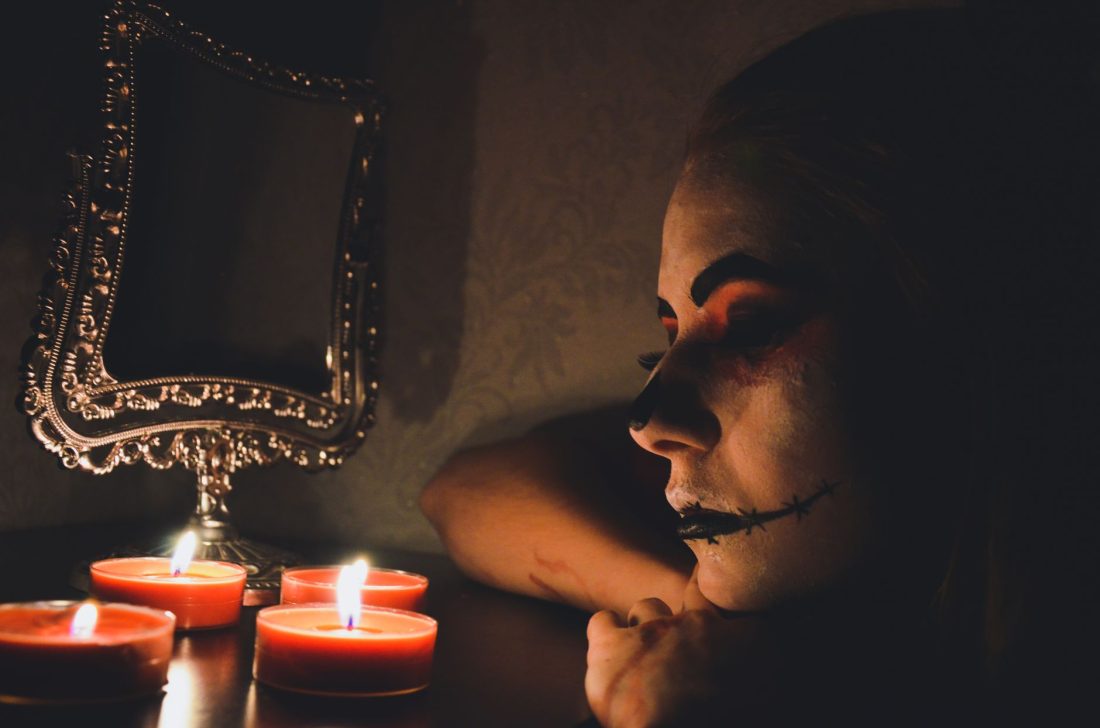 Alternative goth makeup look with dark eyeshadow and bold lips perfect for fall styling and alt fashion aesthetics