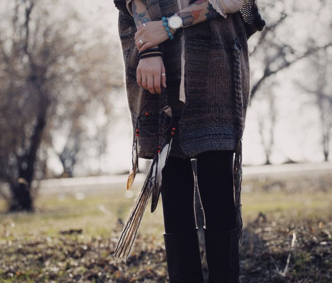 Person styling skinny and Tripp emo pants for fall season with layered alternative fashion outfit